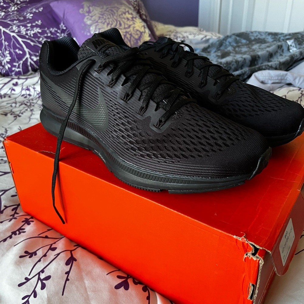Nike running shoes. Bought them but never wore them. Still has paper inside